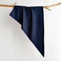 Close-up of navy blue polka dot silk scarf draped elegantly over a natural wood branch - 88*136*64cm / Dark Blue