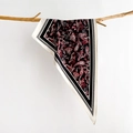 Detailed paisley print on silk-like triangular scarf draped over a natural wooden branch - Geometric Blue / Black (SJ-24)