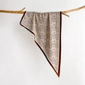Detailed texture of silk triangle scarf with retro chain pattern on wooden branch - Caramel Brown (SJ-28)
