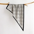 Elegant silk-like triangle scarf with black and white chain print hanging on wood - White (SJ-28)