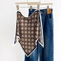 French vintage silk scarf with blue and orange geometric patterns hanging on denim - Blue (SJ-31)
