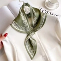 Dark green silk neck scarf with white spiral pattern tied on a white shirt with camellia - 76x13cm / Olive Green Geometric Chain