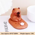 Brown Capybara phone stand figurine with lotus base and peaceful meditation pose - Emotionally Stable Capybara (2530-4E)