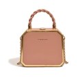 Pink box bag with twisted handle, gold metal frame, and detachable chain shoulder strap - Pink
