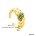 Macro shot of 9.5mm gold adjustable ring with ribbed texture and green zircon inlay - Green Gemstone Twist Style (RI1719J7G)