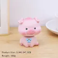 Figurine de cochon rose décorative avec noeud bleu et pendentif étoile pour bureau - Cochon de Pêche Tête Branlante (2572-3B)