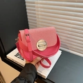 Pink leather saddle bag with red and white striped woven flap and silver buckle - Pink