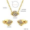 Vue détaillée du set de bijoux en acier doré avec pendentif planète et boucles d'oreilles - Planète Or (SE258002G)