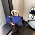Elegant blue crocodile pattern handbag with unique golden handle and shoulder strap - Blue
