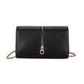 Minimalist black pebble leather crossbody bag with golden chain and zip detail - Black