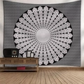 Black and white floral mandala tapestry hung above a wooden cabinet in a cozy room - 150*100CM / Black and White Symmetrical Mandala (Style-12)