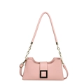 Pink pebbled leather baguette bag with chain strap and black buckle on white background - Pink