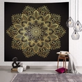 Black and gold mandala tapestry hanging on a white brick wall in a cozy room setting - 95x73cm / Golden Mandala (Style-2)
