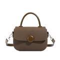 Dark brown textured saddle bag with round buckle, top handle and adjustable shoulder strap - Brown