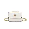 White faux leather mini flap bag with crocodile pattern and golden eagle head hardware - White