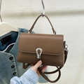Brown litchi grain leather crossbody bag with silver horseshoe metal buckle and top handle - Brown