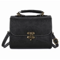 Retro black faux leather handbag featuring embossed floral patterns and bronze metal clasp - Black