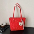 Red fashion tote bag with wrinkled texture, bear charm, and striped silk scarf decoration - Red