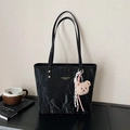 Black crinkle leather tote bag with gold logo and pink teddy bear charm accessory - Black