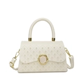 Beige quilted handbag with pearl studs, box shape design and gold metal buckle - White