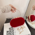 Elegant red velvet oval evening bag with golden round handle and stylish metal chain - Burgundy
