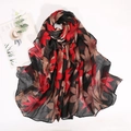 Detailed view of lightweight bali yarn scarf with vintage red and brown floral print patterns - Black