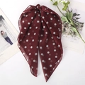 Close-up of wine red polka dot chiffon scarf with soft fabric texture and elegant bow - Coffee