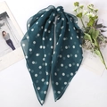 Detailed view of dark green polka dot chiffon hair scarf with elegant long ribbon tails - Green