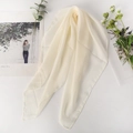 Detailed shot of sheer off-white chiffon scarf showing refined rolled edge and soft texture - 65x65cm / Off White