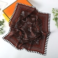 Detail of 70cm square silk scarf featuring bohemian paisley patterns and striped borders - Burgundy