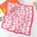 Detailed view of pink shell pattern silk scarf with satin finish and elegant folds - Big Shell Rose Pink