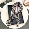 Detail of a chic leopard print scarf tied on a fashion card inside a black display tray - 90*90cm (Bali Yarn) / Khaki