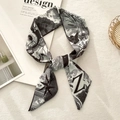 Detailed view of long twilly silk scarf featuring artistic Z letters and star patterns - Letter Z (Off-white Black Hand-drawn)