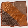 Detailed close-up of a floral print satin silk scarf with vintage geometric patterns - Four-Leaf Clover