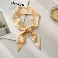 Elegant cream skinny scarf with orange palm leaf print tied in a minimalist knot - Letter E (Cream White Orange Palm Leaf)