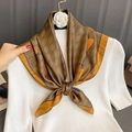 Silk-feel square scarf with vintage pattern tied on a white knit sweater neck - Double C Letter