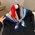 Elegant 70cm satin silk square scarf with colorful geometric print on black sweater - Red Horse