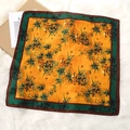 Close-up of floral print satin square scarf on white faux fur background with gift box - 70*70cm / Golden Bamboo