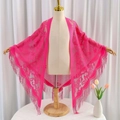Magenta floral lace triangle scarf with long tassels displayed on a mannequin - Rose Red