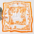 Detailed flat lay of a floral silk scarf with vibrant orange edges on white background - 70*70cm / Sketch Floral - Orange
