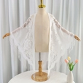 White floral lace triangle scarf with long fringe tassels on a dress form mannequin - 180cm / White