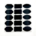 Macro shot of 15 black matte waterproof chalkboard labels in three distinct wavy shapes - 10 Sheets 150 Stickers Total (C305)