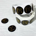 Detail of round black thank you stickers with gold foil text for small business packaging - 25mm/500 Stickers / Black