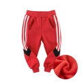 Red kids fleece joggers with white stripes and warm thermal inner lining for winter - 90cm / Rust Red