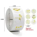 Détail macro de stickers de remerciement dorés ronds de 25mm avec motifs floraux en rouleau - Style Merci Floral Blanc (C137) / 25mm/500 Autocollants