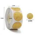 Detail of round 25mm gold foil Thank You stickers on roll with exact size specifications - Kraft Gold Letter Thank You Style (C219) / 25mm/500 Stickers