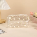Macro detail of transparent pencil case with clover patterns and top zipper closure - Clover (White)