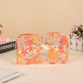 Beauty case in PVC trasparente con fiori arancioni e chiusura a zip in metallo lucido - Fiore Grande (Arancione)