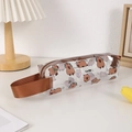 Détail de la trousse Capybara transparente en PVC avec poignée marron et motifs mignons - Style Capybara (Musique)