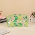 Detail of transparent PVC pencil case featuring green floral patterns and zipper closure - Large Flower (Green)